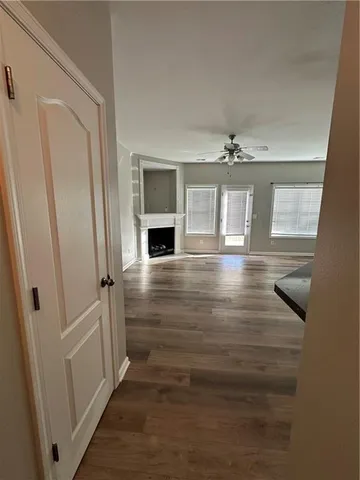 a view of entryway and hall with wooden floor