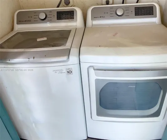 a utility room with washer and dryer