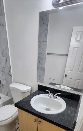 a bathroom with a sink and a toilet