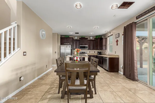 a kitchen with stainless steel appliances kitchen island granite countertop a sink and cabinets