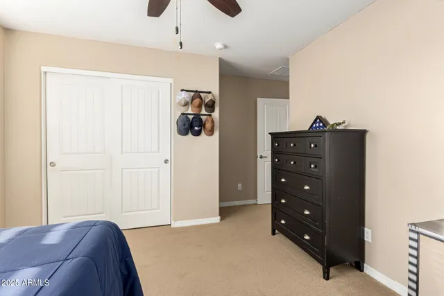 a bedroom with a bed and a dresser