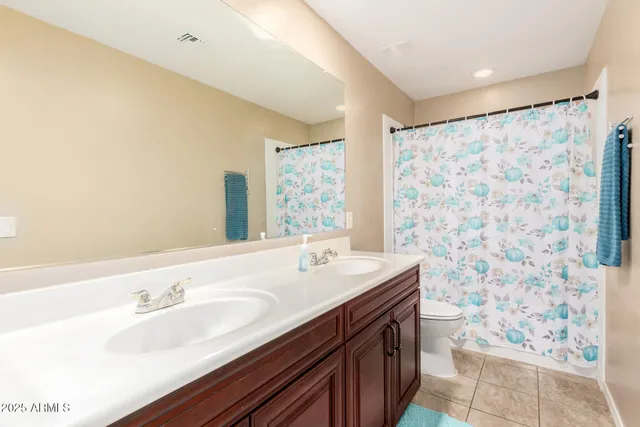 a bathroom with a sink a mirror and a shower