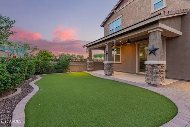 a view of a backyard with potted plants