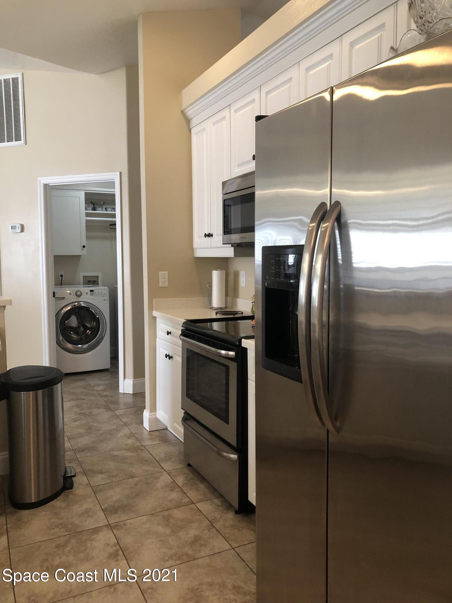 2865 Digby Road Southeast Palm Bay, FL 32909 - Photo 12 of 42 a kitchen with a refrigerator and a stove
