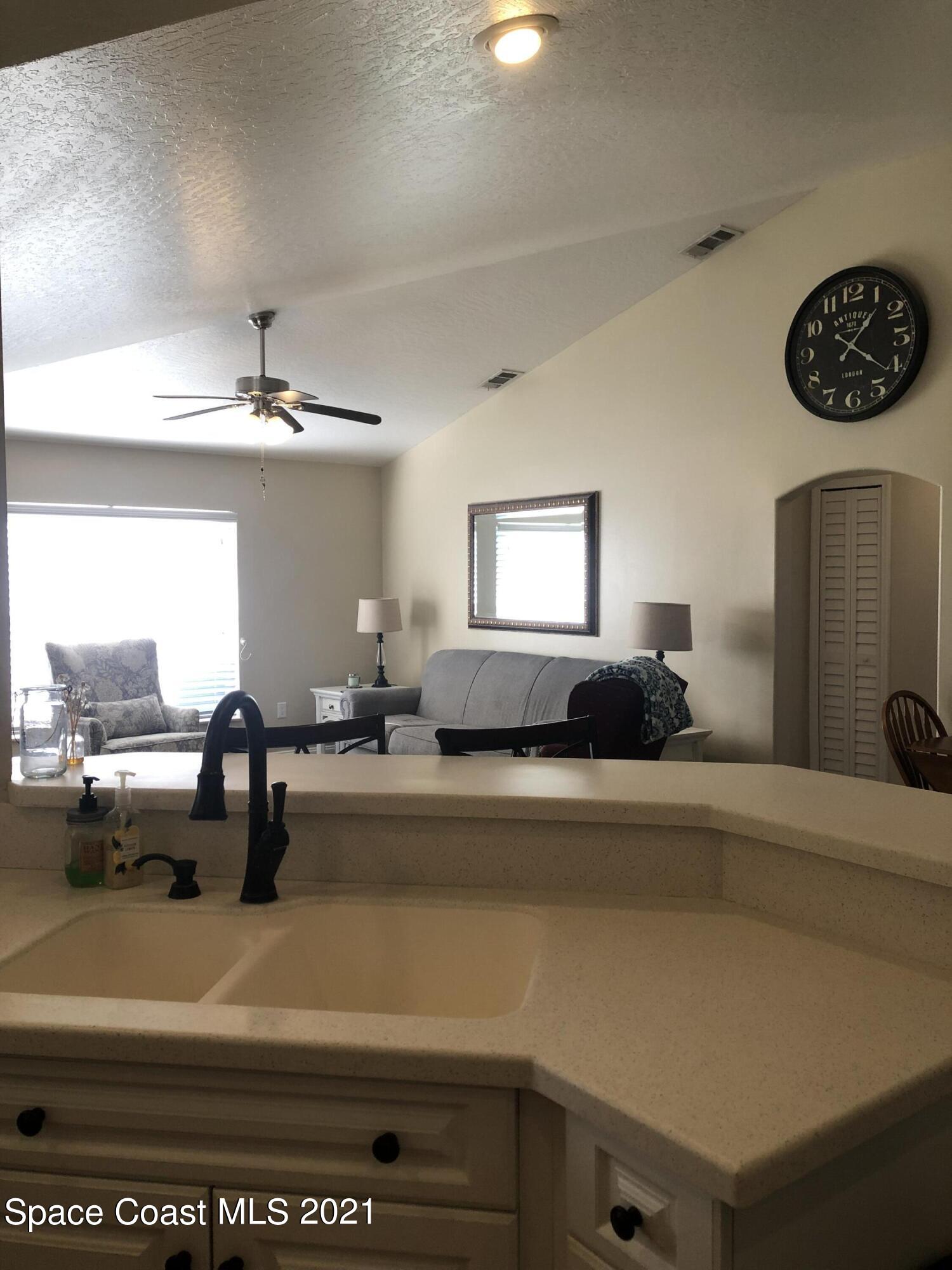2865 Digby Road Southeast Palm Bay, FL 32909 - Photo 13 of 42 a view of living room and kitchen