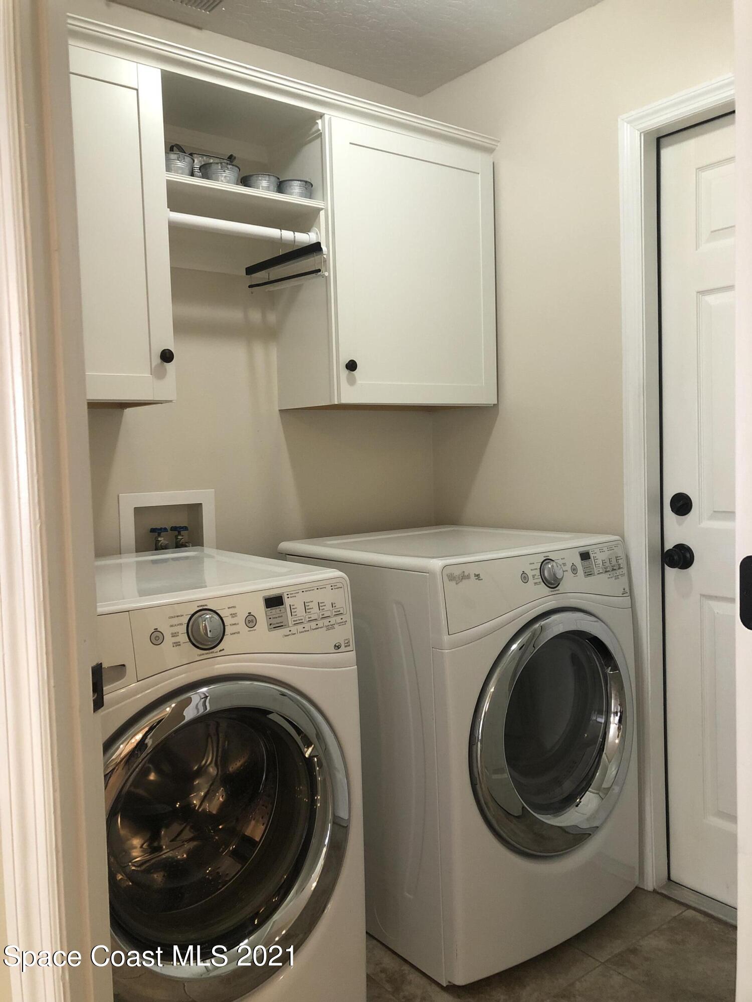 2865 Digby Road Southeast Palm Bay, FL 32909 - Photo 21 of 42 a utility room with dryer and washer