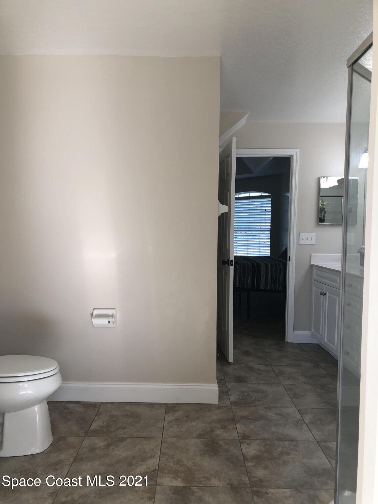 2865 Digby Road Southeast Palm Bay, FL 32909 - Photo 27 of 42 a bathroom with a toilet and a sink