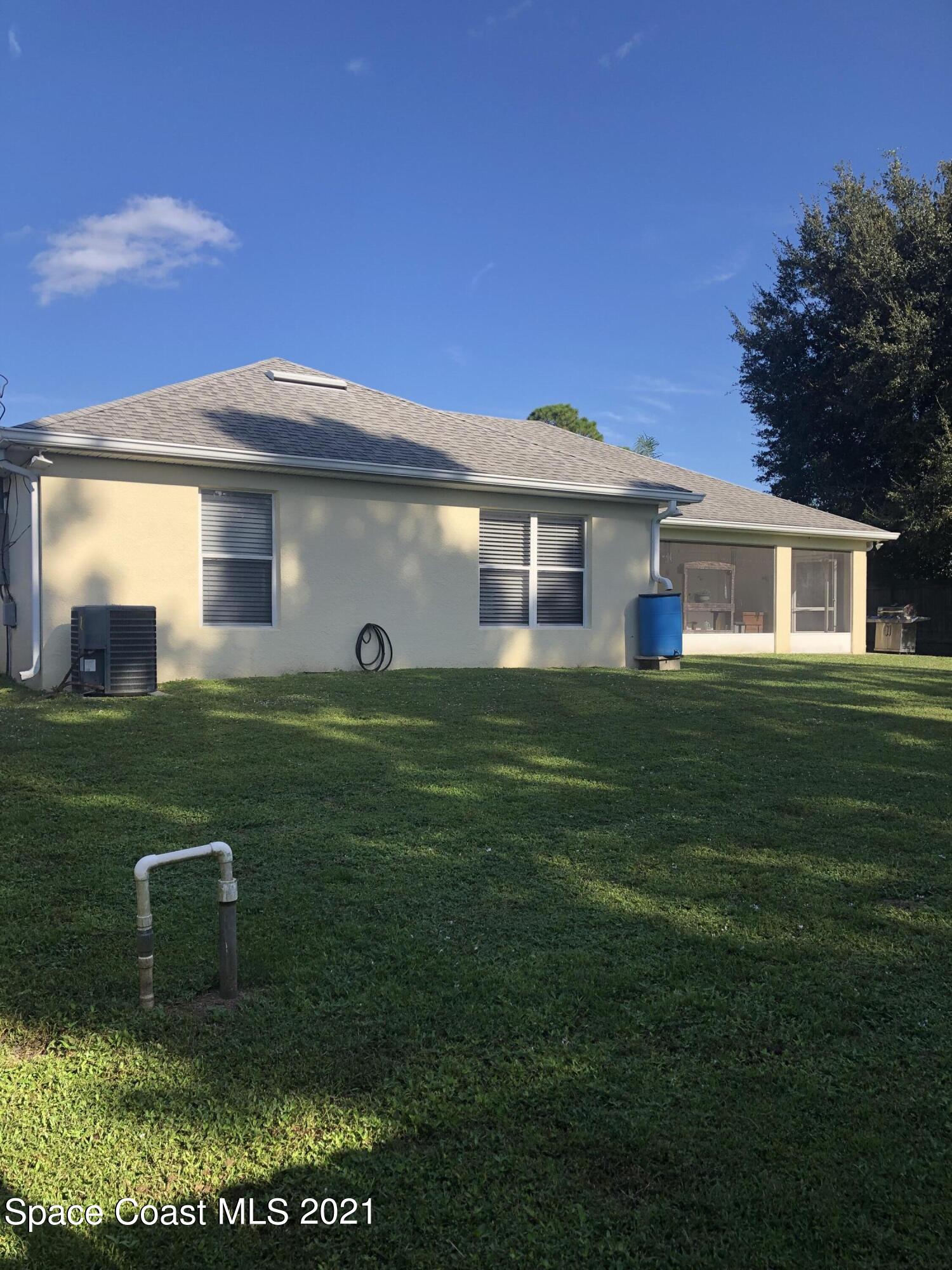 2865 Digby Road Southeast Palm Bay, FL 32909 - Photo 41 of 42 a view of a house with a yard
