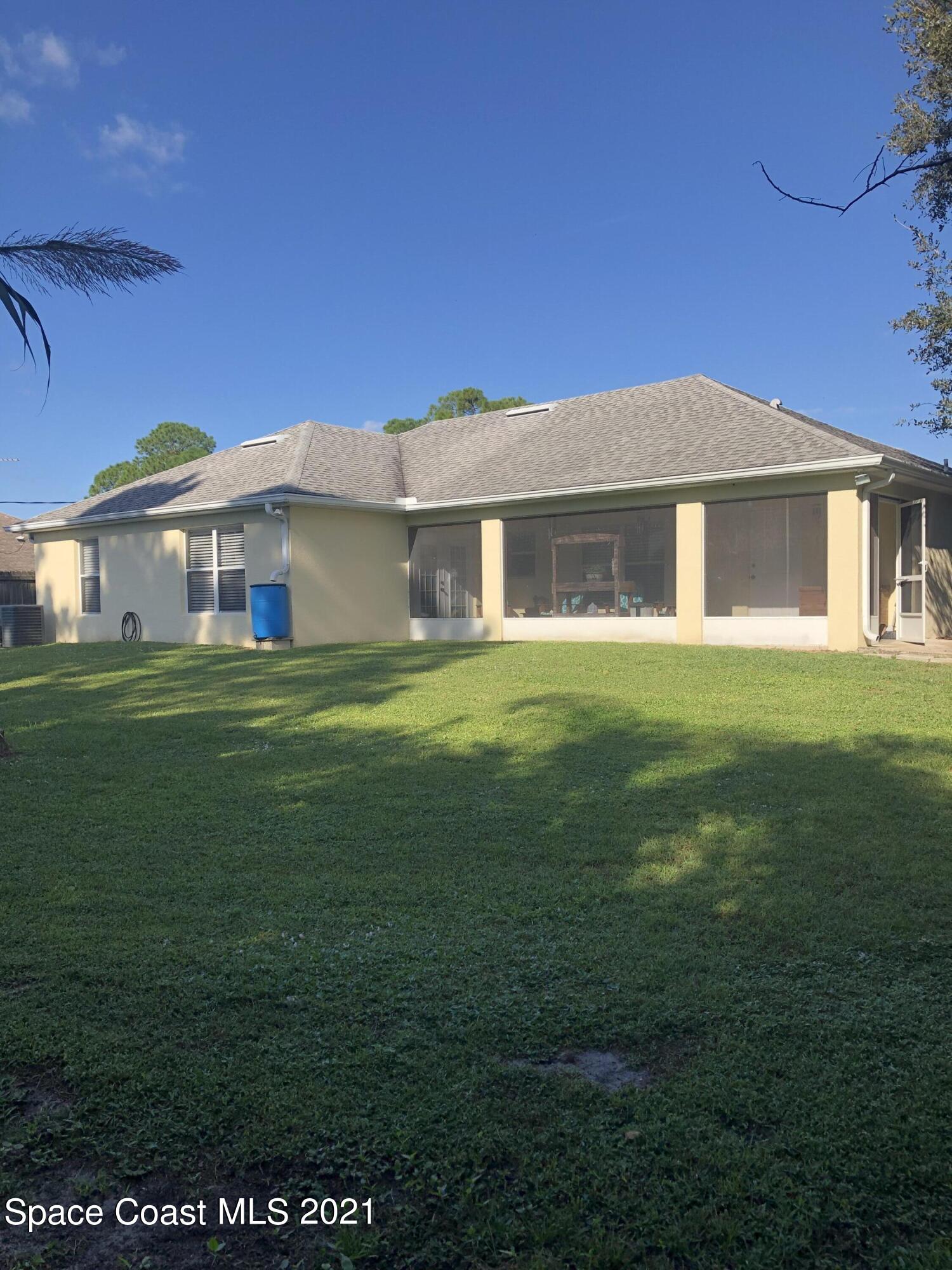 2865 Digby Road Southeast Palm Bay, FL 32909 - Photo 42 of 42 a front view of a house with a garden
