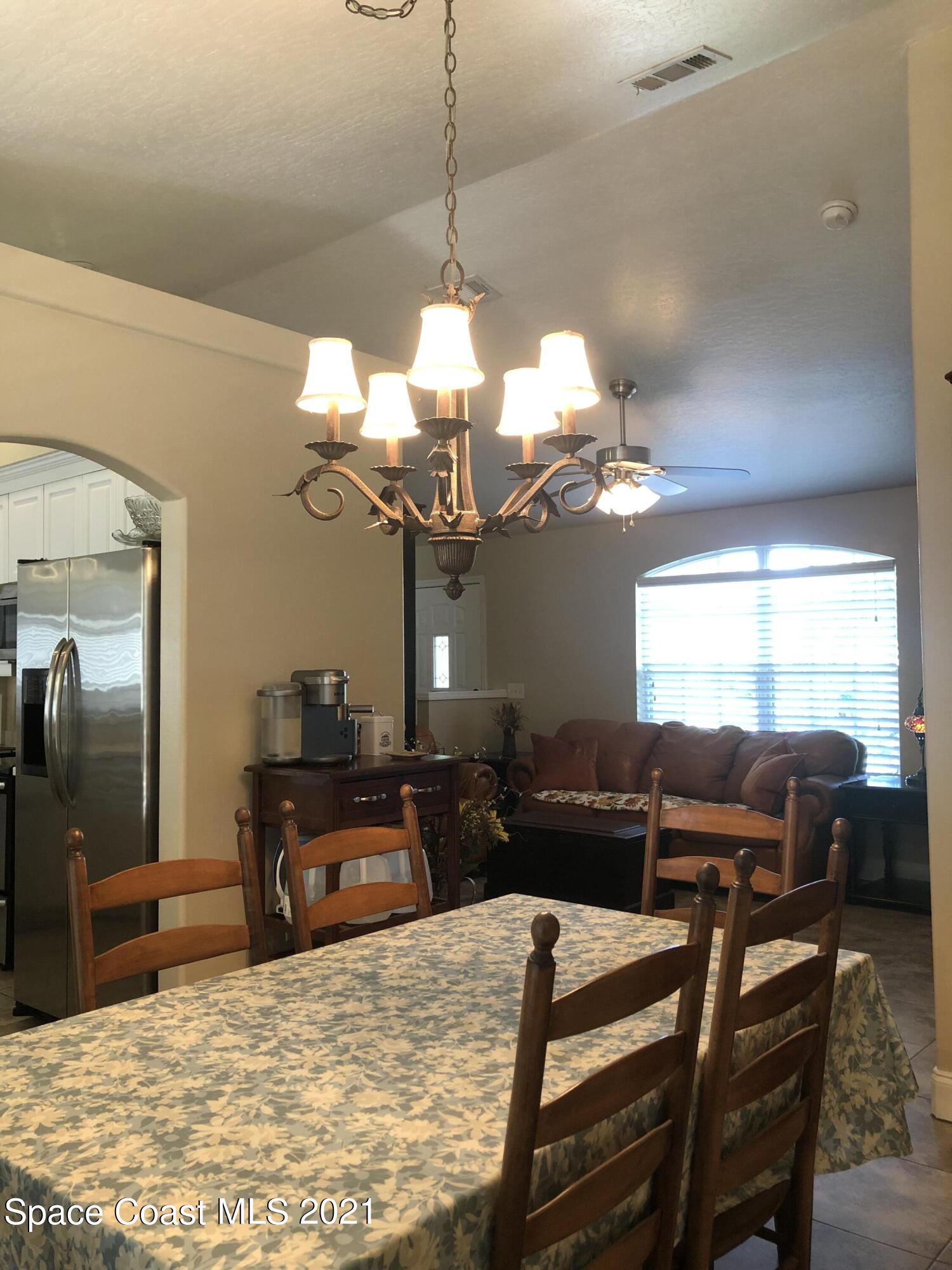 2865 Digby Road Southeast Palm Bay, FL 32909 - Photo 9 of 42 a view of a dining room with furniture