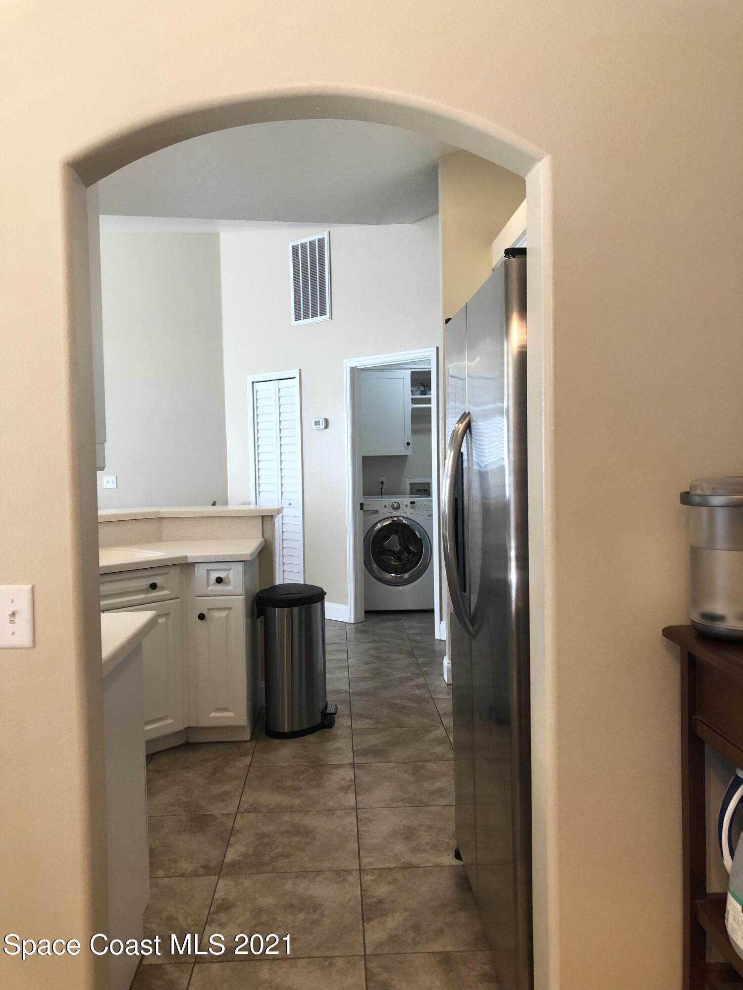2865 Digby Road Southeast Palm Bay, FL 32909 - Photo 10 of 42 a kitchen with stainless steel appliances a refrigerator and stove