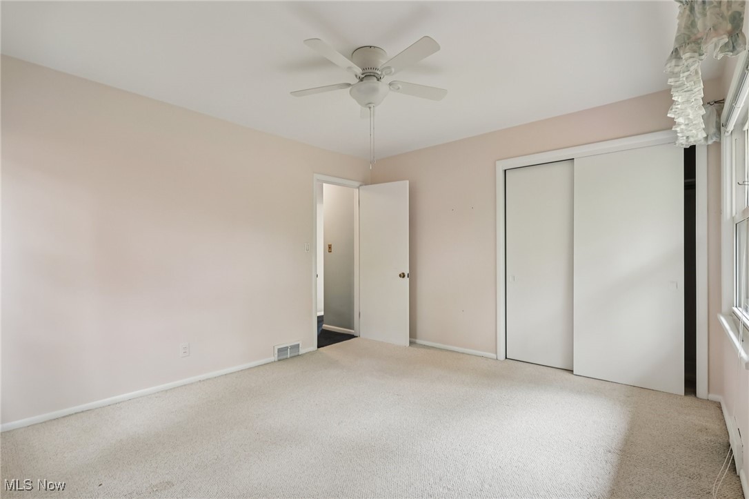 33300 South Woodland Road Cleveland, OH 44124 - Photo 36 of 50 Unfurnished bedroom with carpet flooring, a closet, and ceiling fan