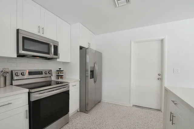 a garden with trees in the background