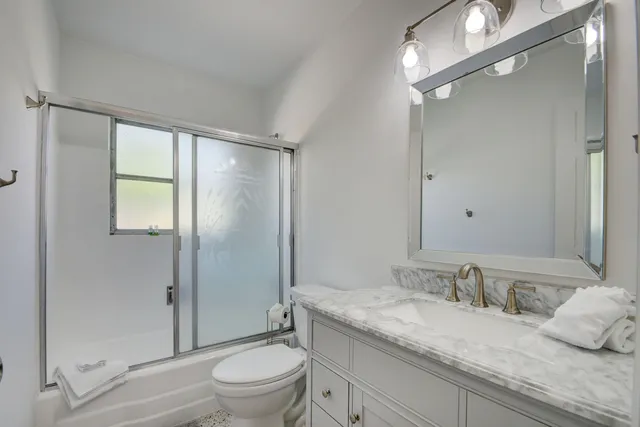 a view of room with window and bathroom view