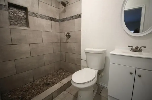 a bathroom with a toilet and a sink