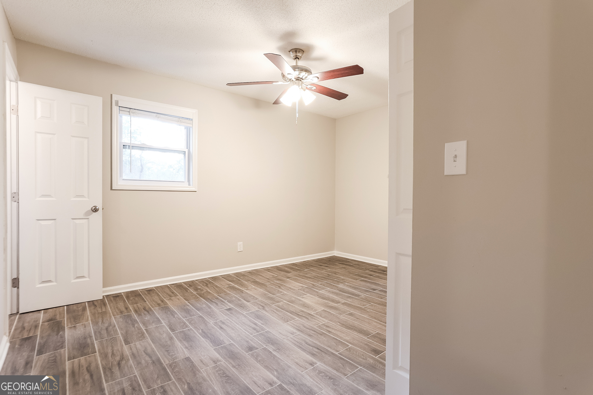 8621 Chestnut Lane Lithia Springs, GA 30122 - Photo 11 of 16 a view of an empty room with a window