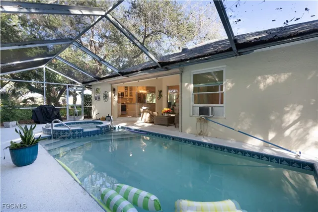 a view of a swimming pool with a patio
