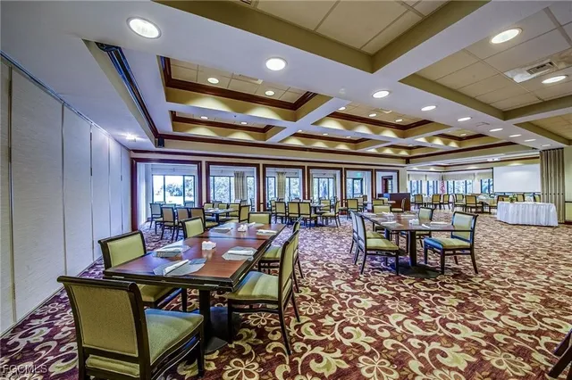 a dining room with lots of tables and chairs