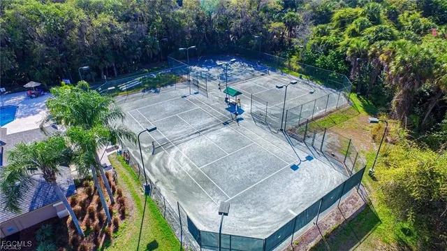 an aerial view of a house with a yard and balcony