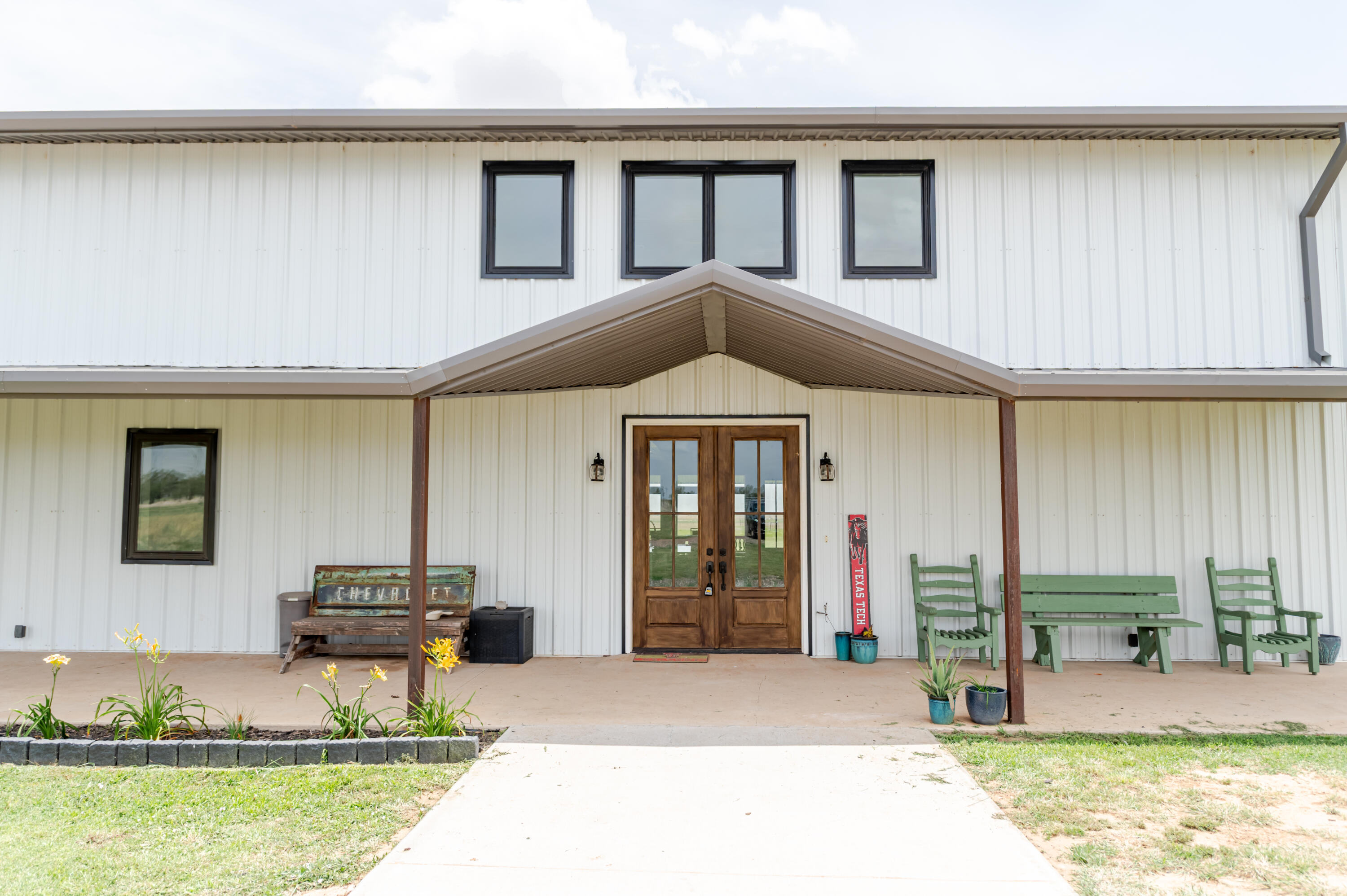 6792 Maine Road Anton, TX 79313 - Photo 63 of 77 a front view of a house with swimming pool and porch
