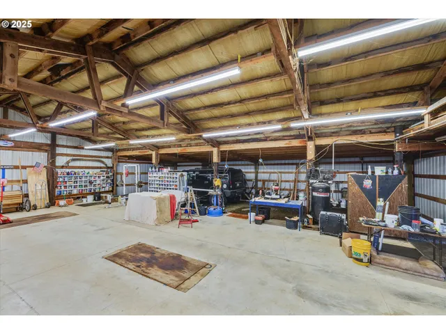 a room with furniture and a kitchen view