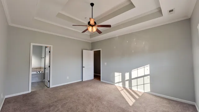 a view of a livingroom with a ceiling fan and window