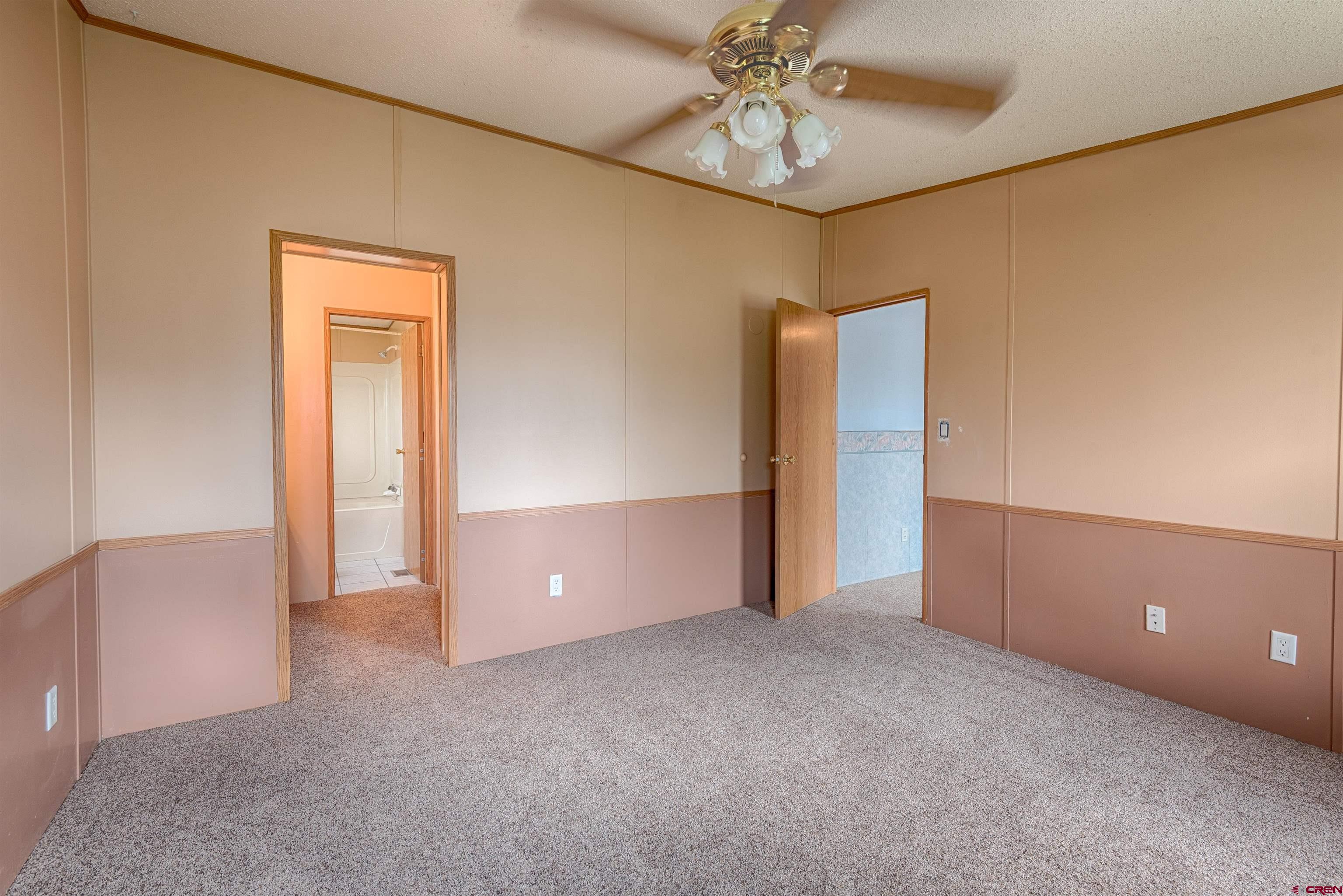 67135 N Road Montrose, CO 81401 - Photo 24 of 33 a view of an empty room and chandelier fan