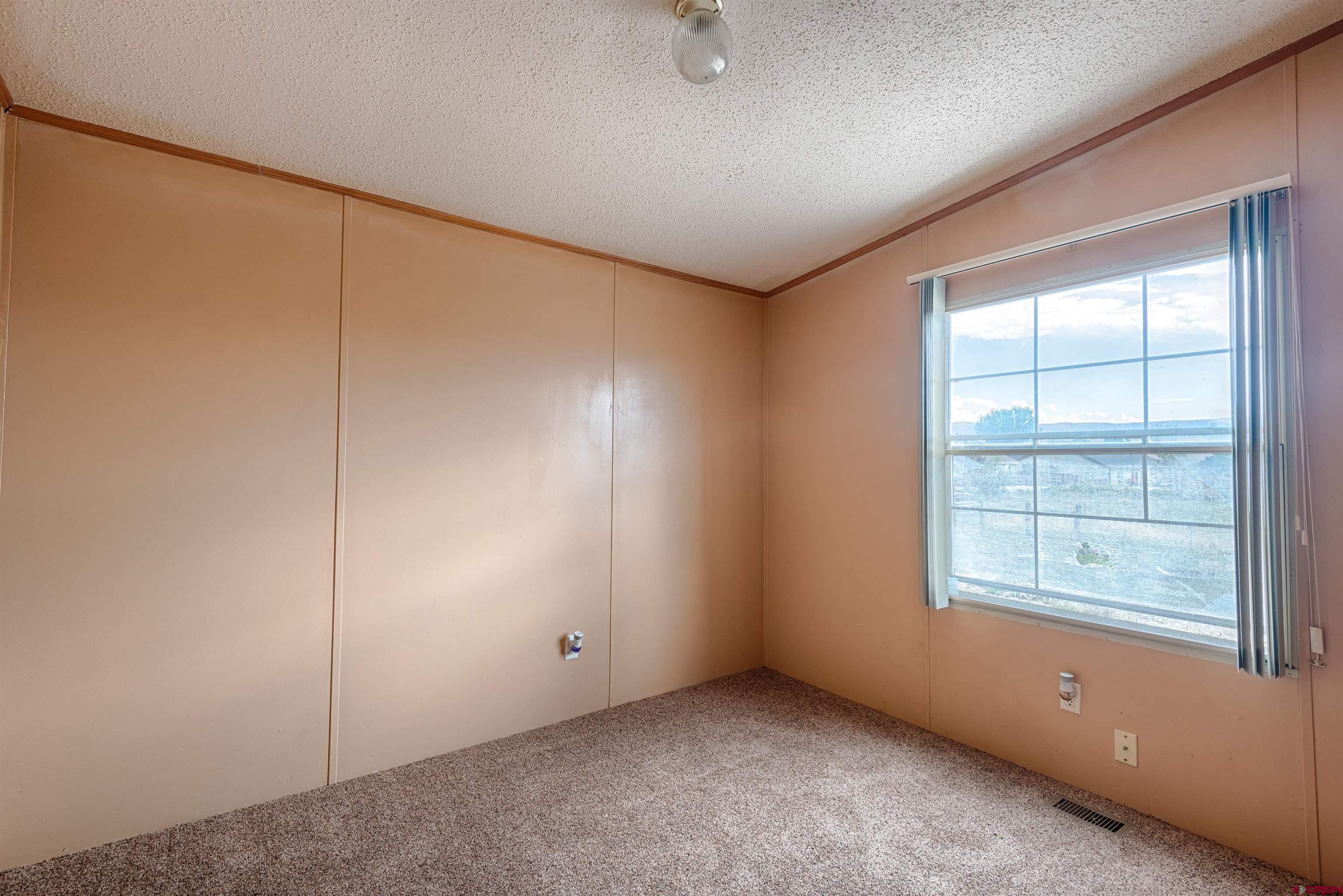 67135 N Road Montrose, CO 81401 - Photo 27 of 33 an empty room with windows