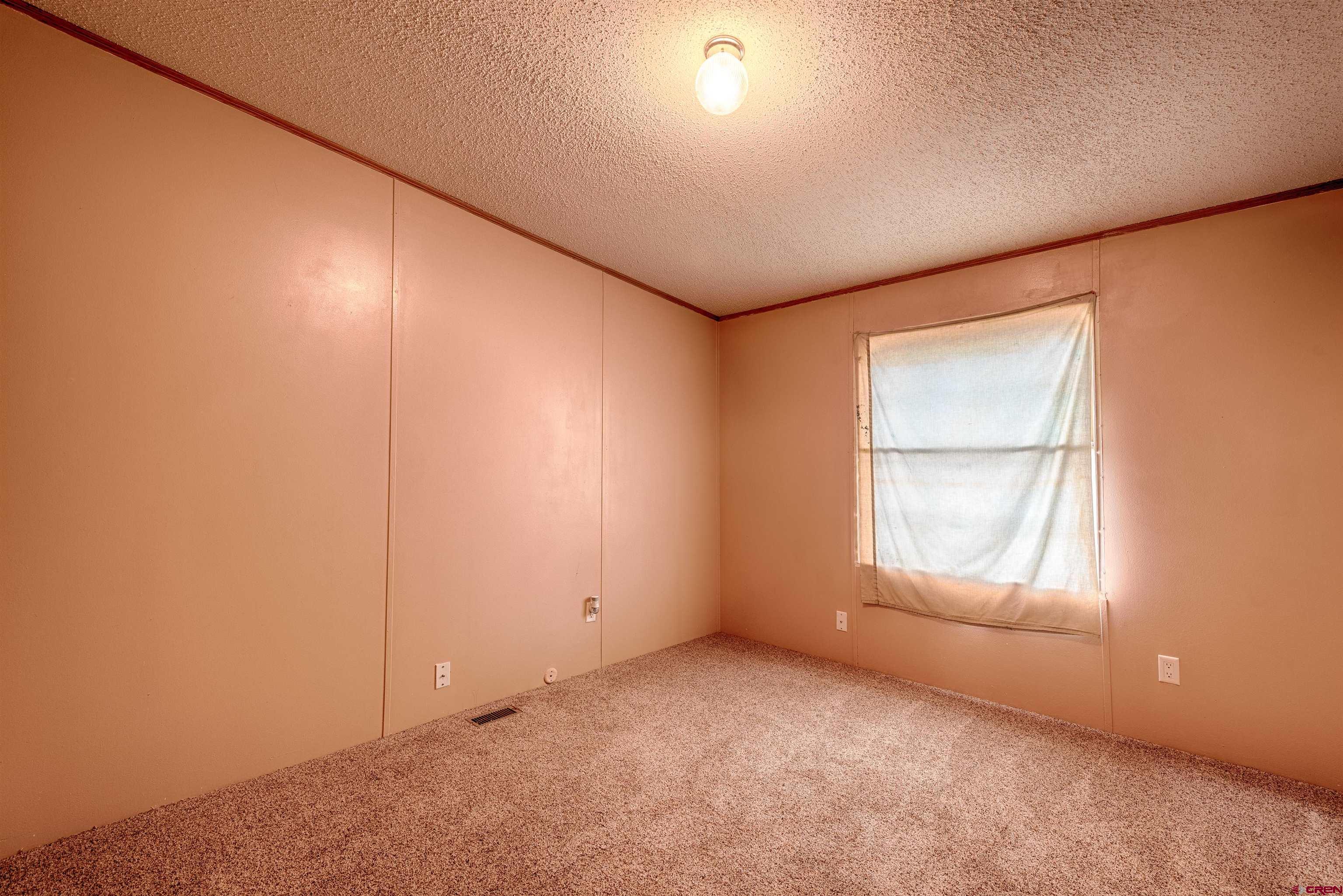 67135 N Road Montrose, CO 81401 - Photo 31 of 33 an empty room with a window
