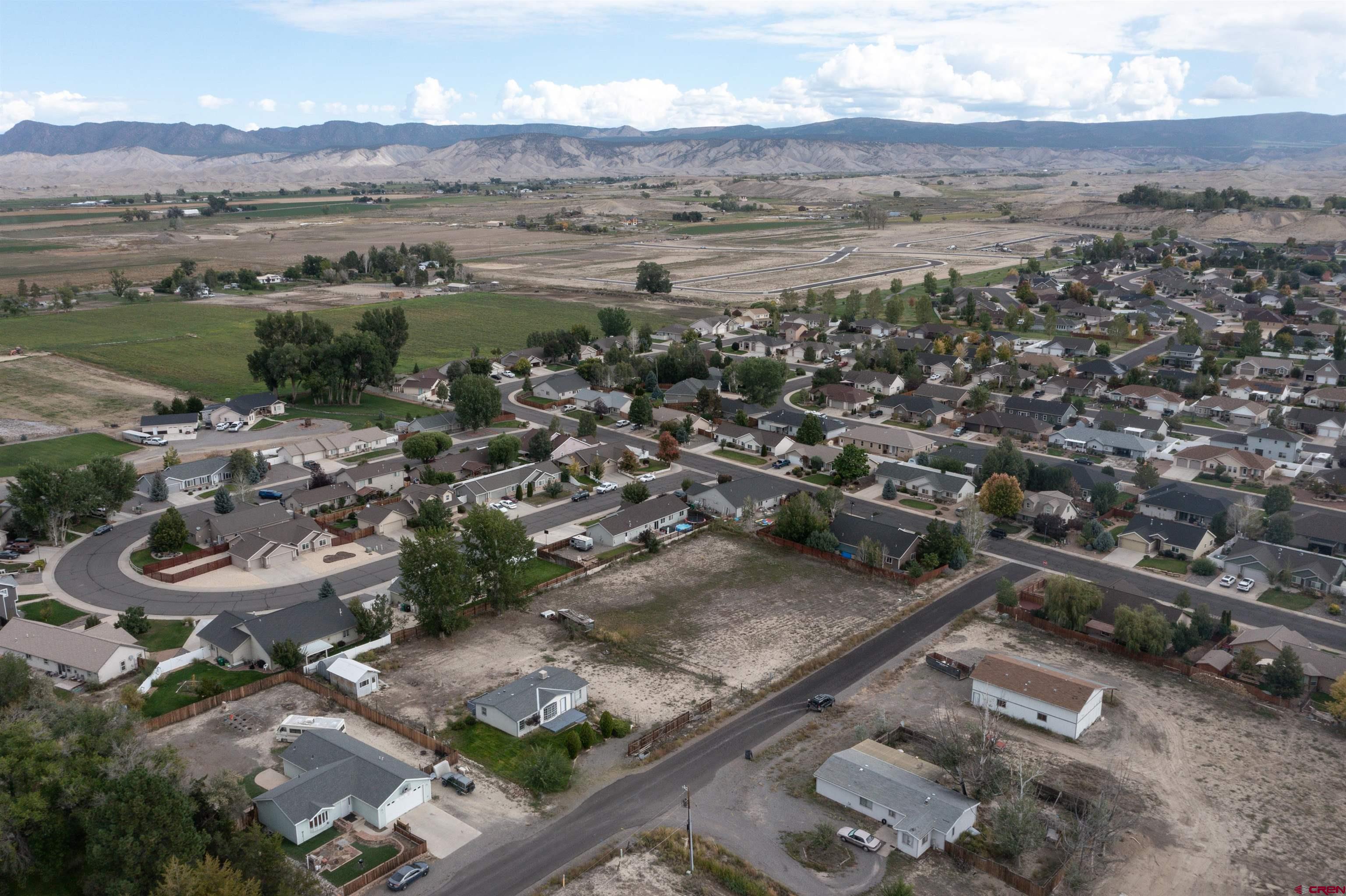 67135 N Road Montrose, CO 81401 - Photo 6 of 33 an aerial view of a residential houses and outdoor space