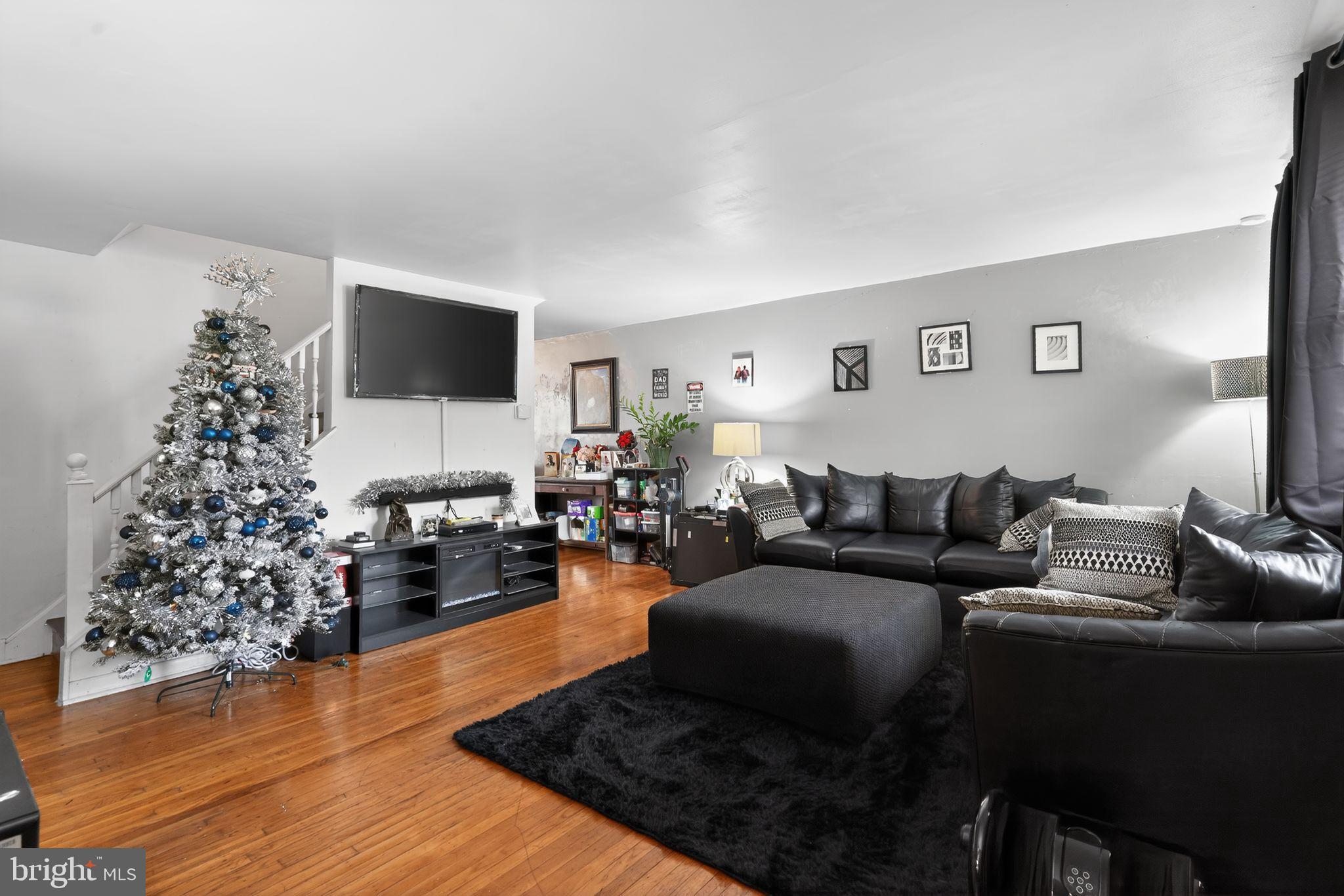 a living room with furniture or couch and a flat screen tv
