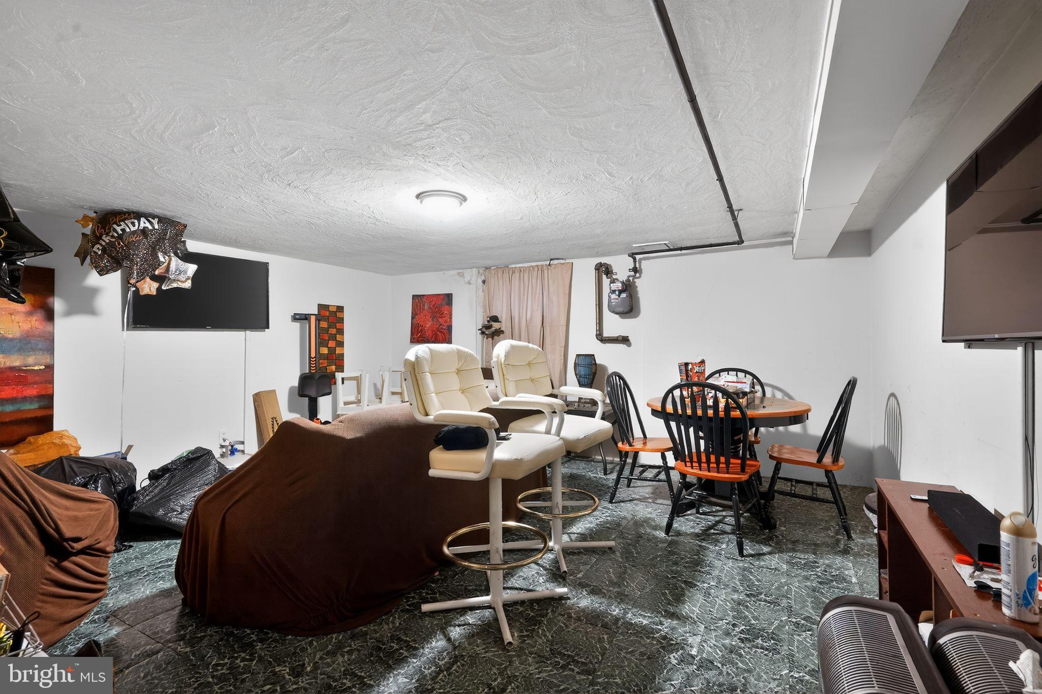 4026 Gideon Road Brookhaven, PA 19015 - Photo 11 of 28 a living room with furniture a rug and white walls