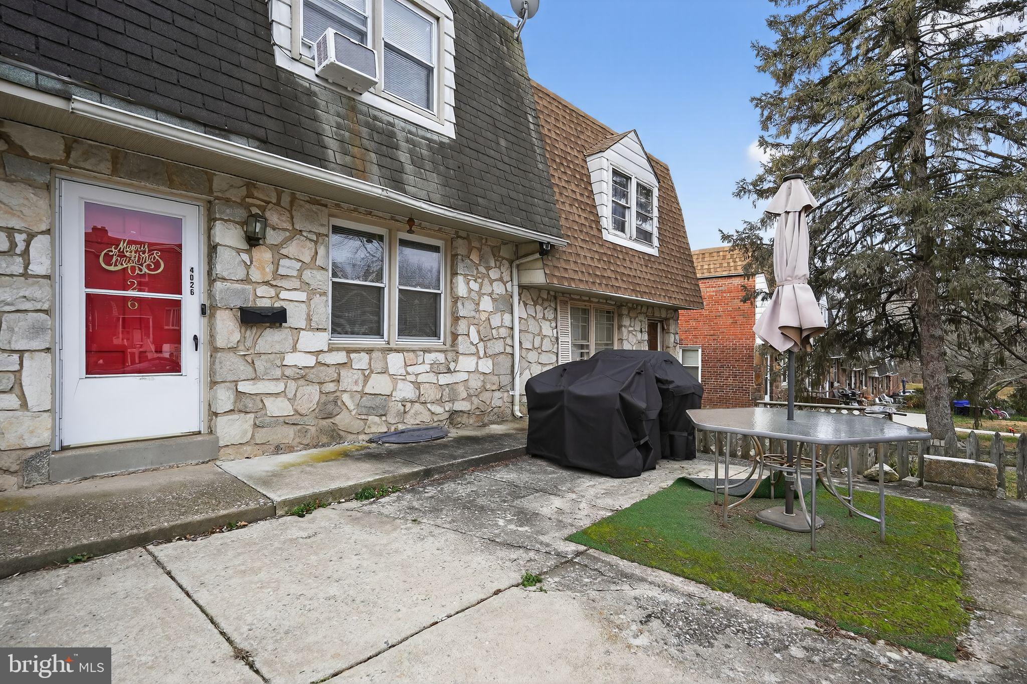 4026 Gideon Road Brookhaven, PA 19015 - Photo 13 of 28 a view of a brick building with a bench in front of building