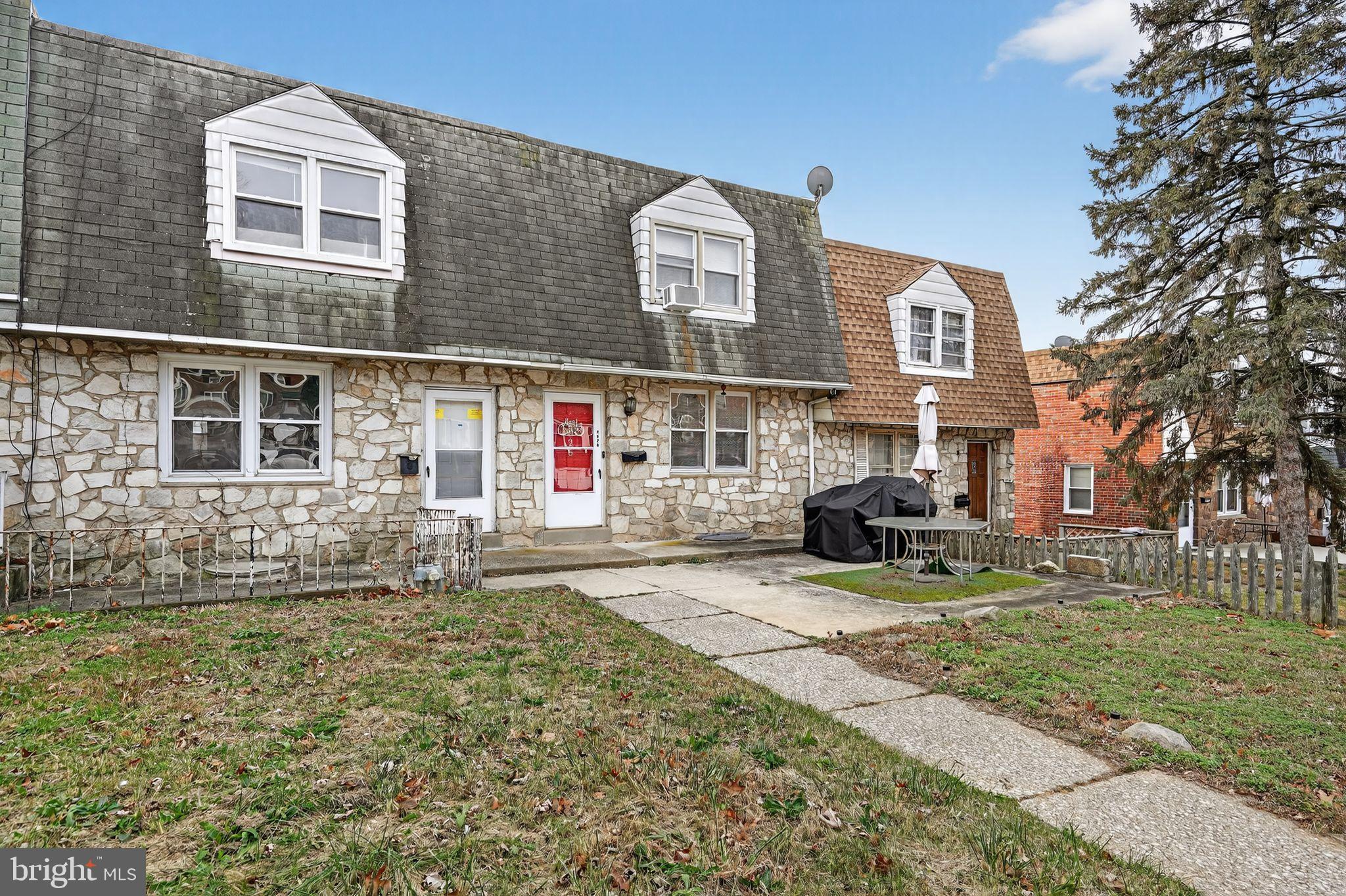 4026 Gideon Road Brookhaven, PA 19015 - Photo 15 of 28 a front view of a house with a yard and garage