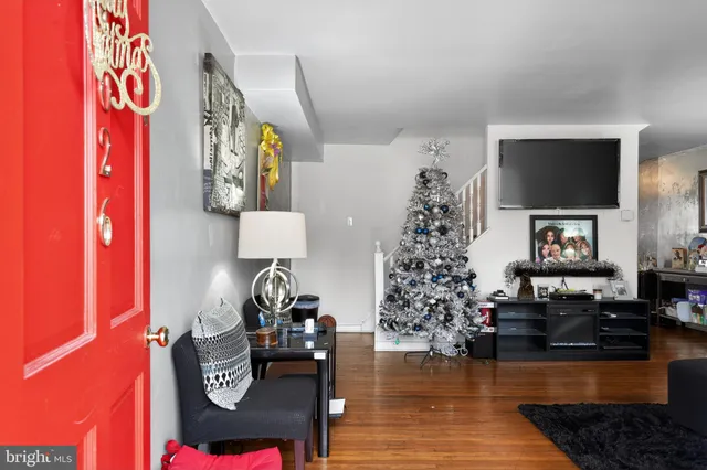 a living room with furniture and a flat screen tv