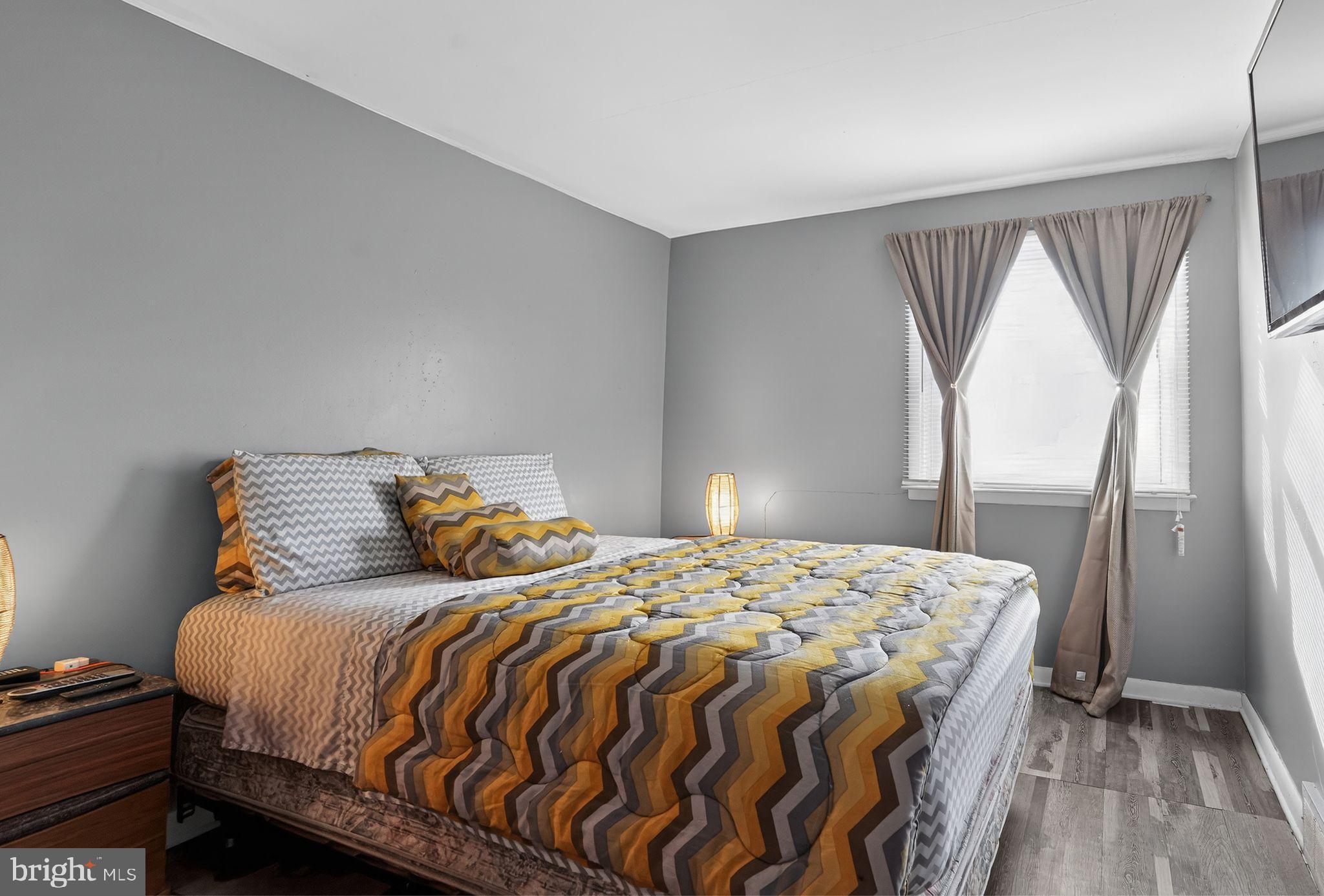 4026 Gideon Road Brookhaven, PA 19015 - Photo 7 of 28 a bedroom with a bed and wooden floor