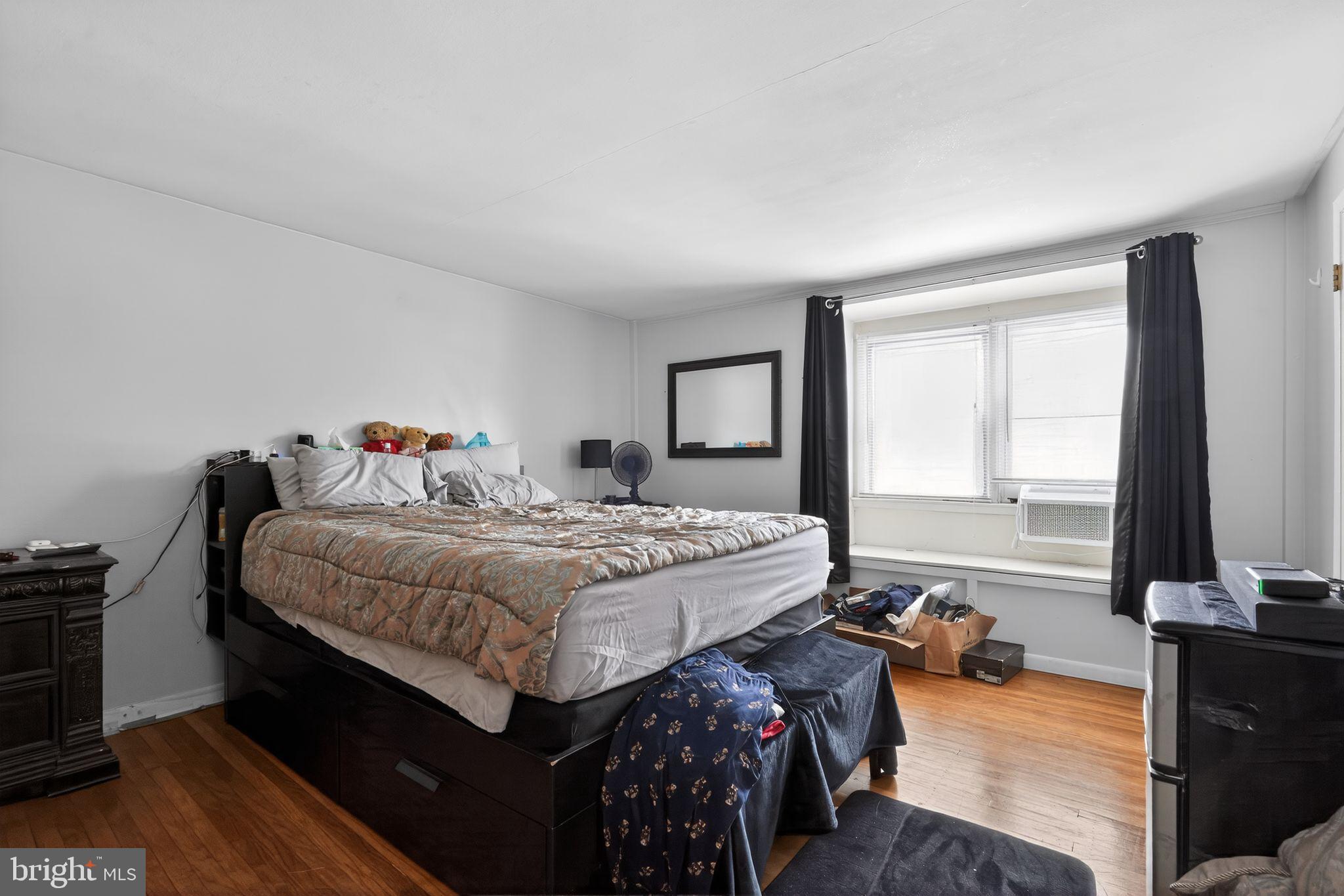 4026 Gideon Road Brookhaven, PA 19015 - Photo 10 of 28 a bedroom with a bed and wooden floor