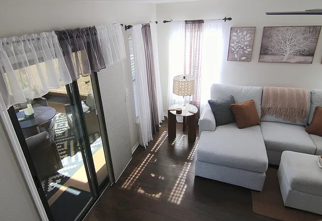 a living room with furniture and a flat screen tv