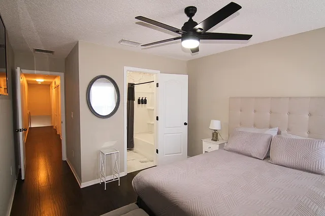 a bathroom with a shower a bathtub and a shower