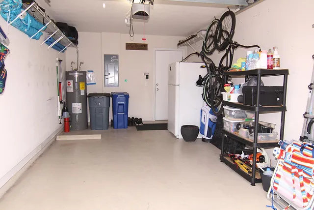 a living room with patio fireplace furniture and a large window