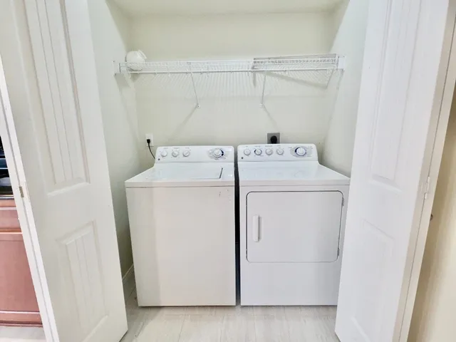 a utility room with dryer and washer