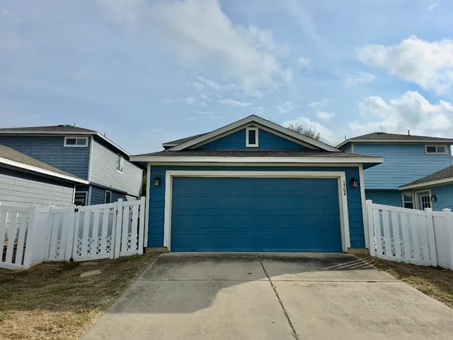 a front view of a house with a garage