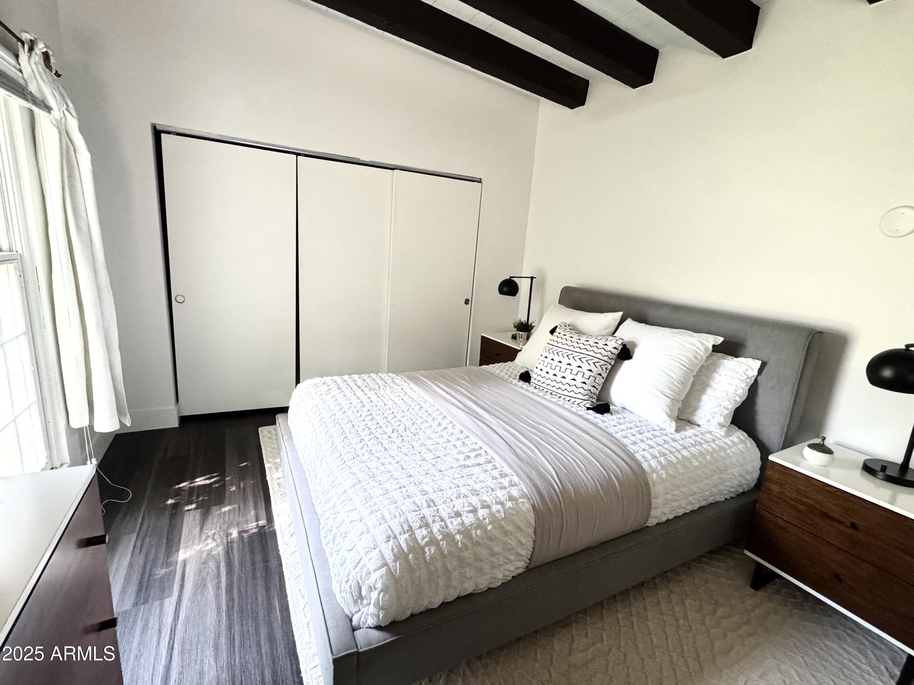 3134 North 28th Street Phoenix, AZ 85016 - Photo 12 of 21 a bedroom with a bed and a window