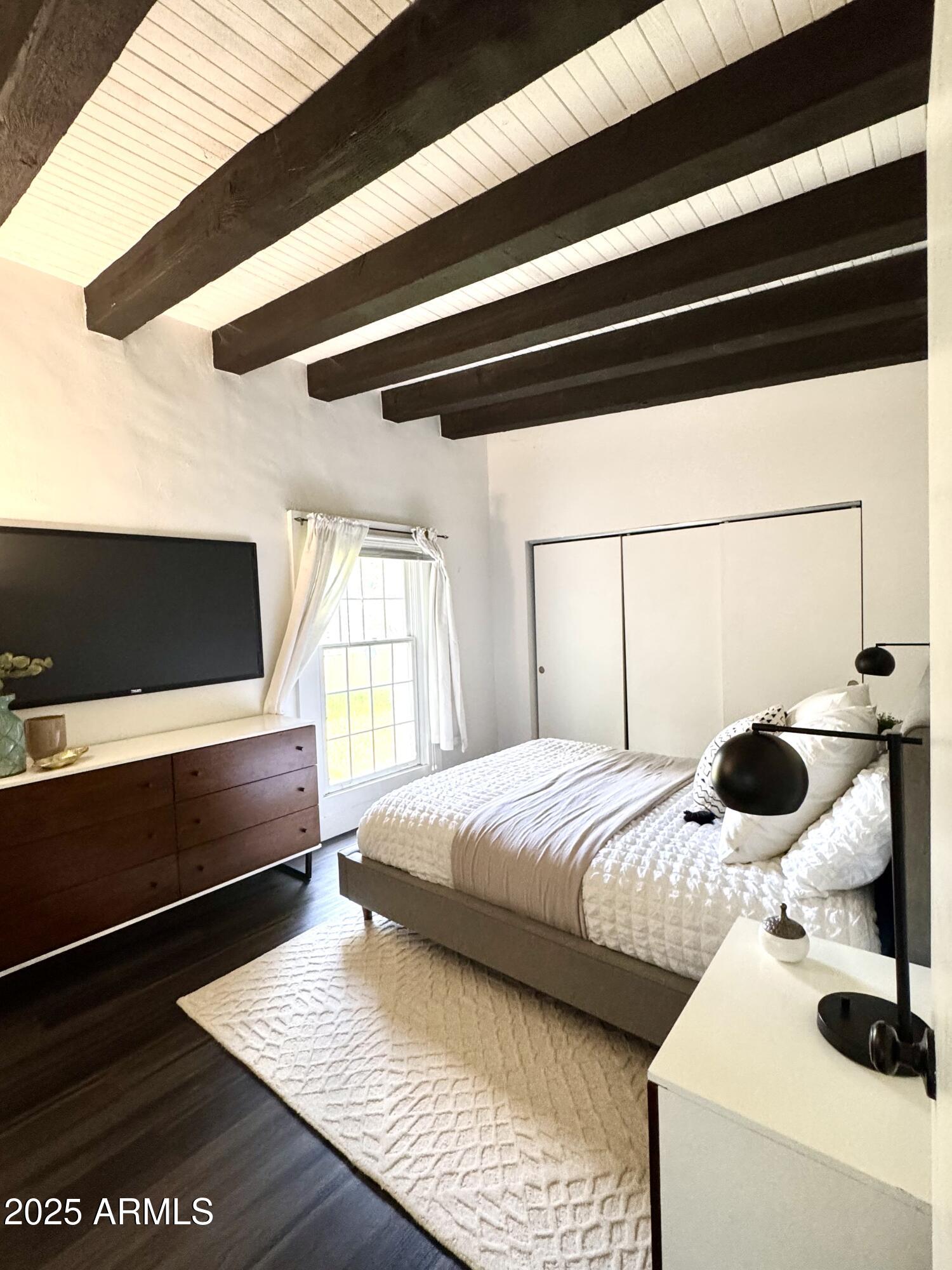 3134 North 28th Street Phoenix, AZ 85016 - Photo 13 of 21 a bedroom with a bed and a window