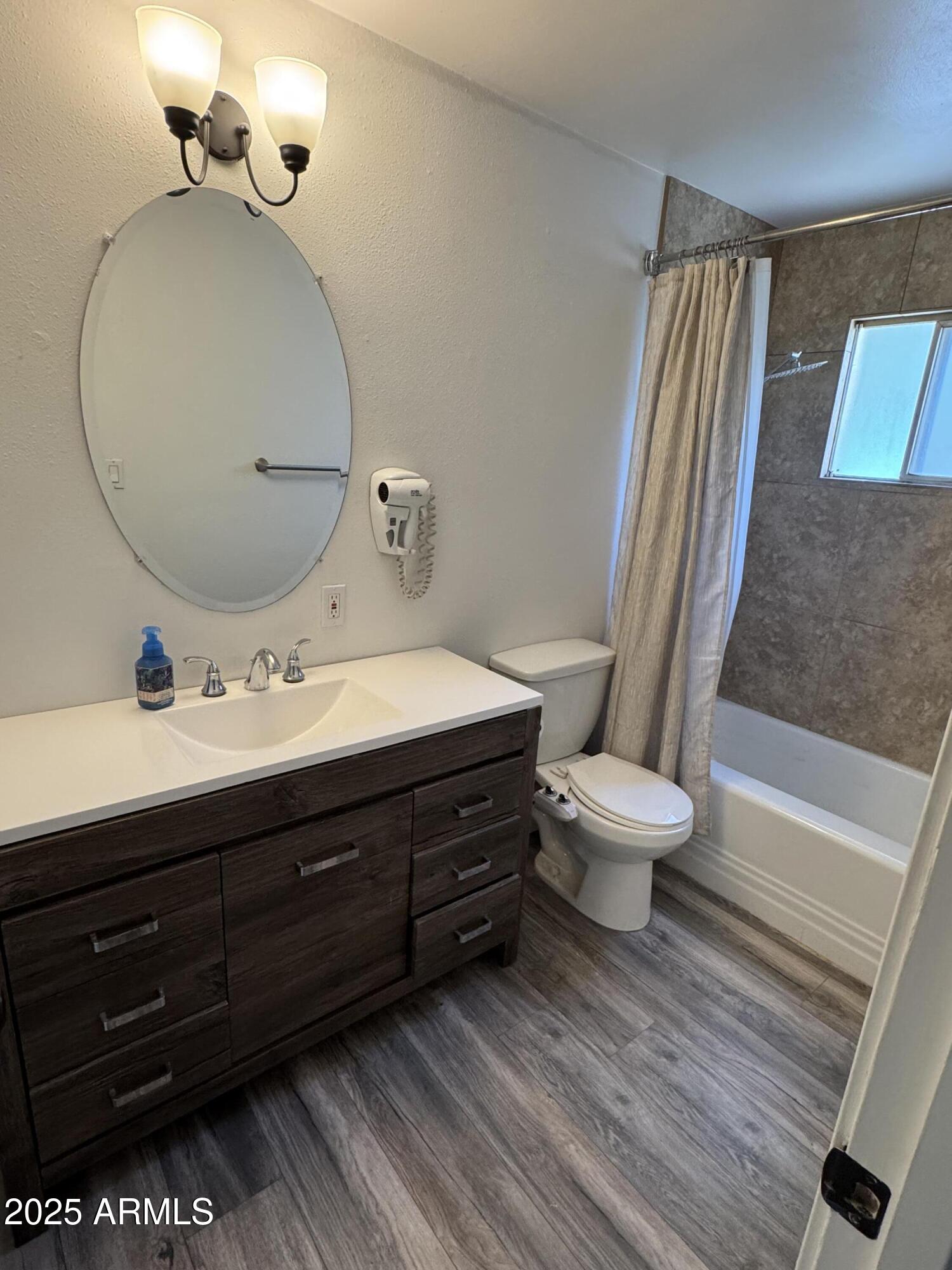3134 North 28th Street Phoenix, AZ 85016 - Photo 19 of 21 a bathroom with a sink and a mirror
