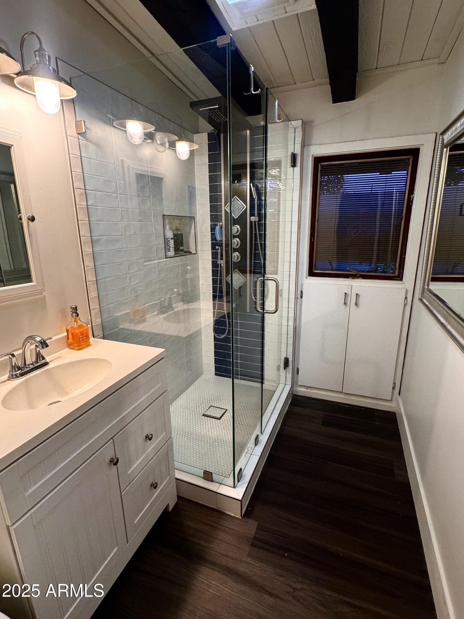 3134 North 28th Street Phoenix, AZ 85016 - Photo 4 of 21 a bathroom with a double vanity sink and mirror