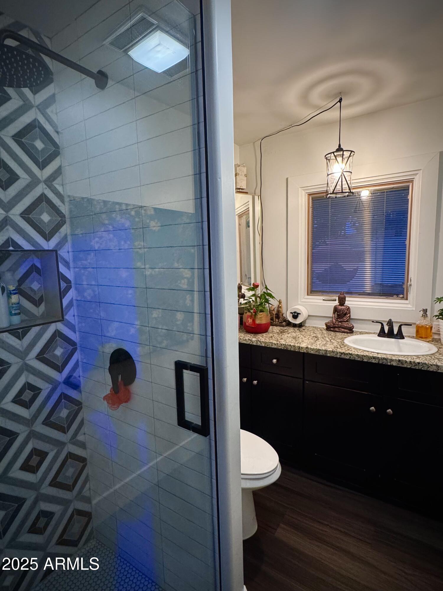 3134 North 28th Street Phoenix, AZ 85016 - Photo 6 of 21 a bathroom with a sink and mirror