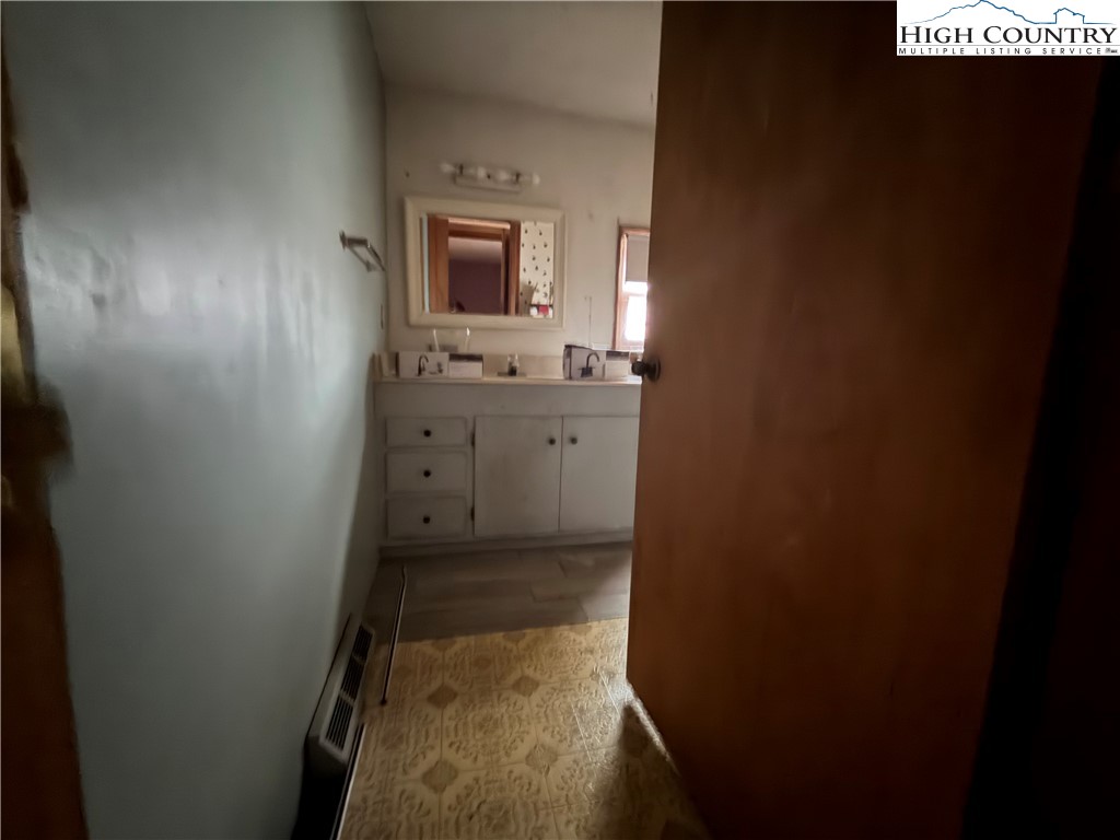 1630 Pleasant Ridge Road State Road, NC 28676 - Photo 14 of 17 a bathroom with a sink and a mirror