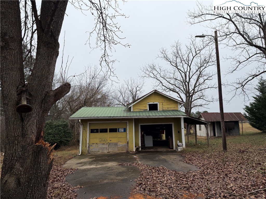 1630 Pleasant Ridge Road State Road, NC 28676 - Photo 5 of 17 a front view of a house with a garden