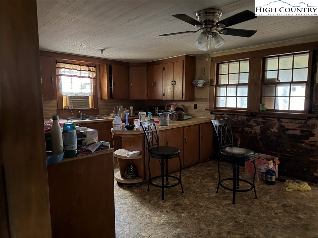 1630 Pleasant Ridge Road State Road, NC 28676 - Photo 7 of 17 a view of a workspace with furniture and a window